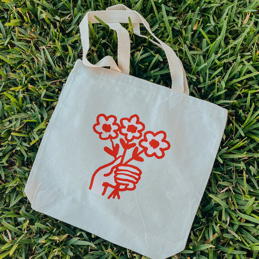 Holding Flowers Tote Bag
